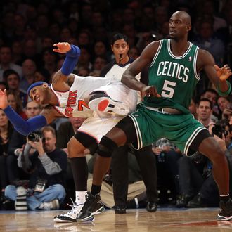 Kevin Garnett #5 of the Boston Celtics and Carmelo Anthony #7 of the New York Knicks bump at Madison Square Garden on January 7, 2013 in New York City. 