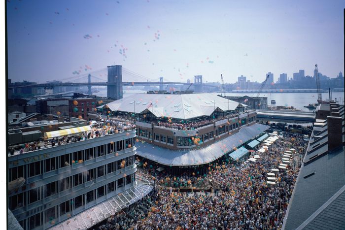 Crowds filling the South Street Seaport complex on opening day after a renovation designed by the Rouse Co. & Benjamin Thompson + Associates in conjunction w. New York City and New York State., USA