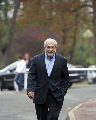 Former IMF chief Dominique Strauss-Kahn arrives to a polling station for the Socialist party's (PS) 2011 primary vote for France's 2012 presidential election on October 9, 2011 in Sarcelles, northern suburb of Paris. The Socialists are hoping that hundreds of thousands of people will head to the voting centres specially set up for the primary vote held in two rounds today and October 16. Strauss-Kahn was forced to resign as managing director of IMF when he was arrested in May 2011 and charged with the sexual assault and attempted rape of hotel maid Nafissatou Diallo in his suite at the Sofitel hotel in Manhattan. Strauss-Kahn, who was seen as a frontrunner in next year's French presidential election before the charges were brought against him, returned to France on September 4. AFP PHOTO / MIGUEL MEDINA (Photo credit should read MIGUEL MEDINA/AFP/Getty Images)