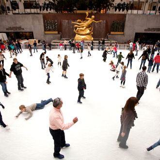 People ice skate at Rockefeller Center on November 26, 2011 in New York City. With the holidays less than a month away and as is tradition, Manhattan retailers have decorated their department store displays for the season with elaborate designs and animated scenes.
