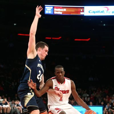 St. John's Phil Greene IV drives past Notre Dame's Pat Connaughton during the second half of the NCAA college basketball game, Tuesday, Jan. 15, 2013, at Madison Square Garden in New York. St. John's won 67-63.