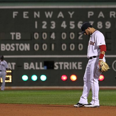 BOSTON, MA - SEPTEMBER 15: Mike Aviles #3 of the Boston Red Sox kicks the dirt in the ninth inning during a game with Tampa Bay Rays at Fenway Park September 15, 2011 in Boston, Massachusetts. The Red Sox lost 9-1. (Photo by Jim Rogash/Getty Images)