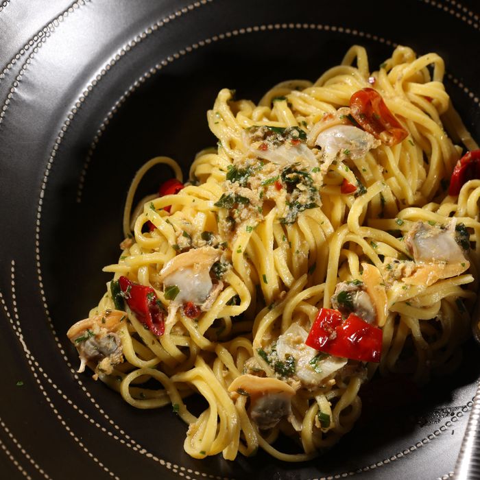 Spaghetti with Manila clams, ramazotti, and Madras curry.