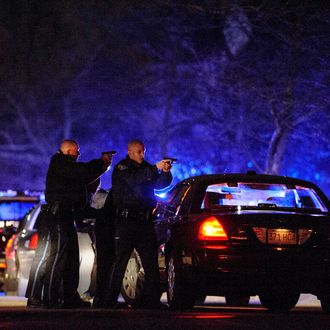 Cops hunt for a suspect on Walnut St. on Friday, Apr. 19, 2013 in Watertown, Mass. One suspect is dead, but another remains at large following violent incidents overnight that took the life of a police officer and shook the outskirts of the city. Authorities confirmed early Friday that the incidents in Cambridge and Watertown, Mass., were directly connected to the Boston Marathon attack Monday. (Photo by James Keivom/NY Daily News via Getty Images