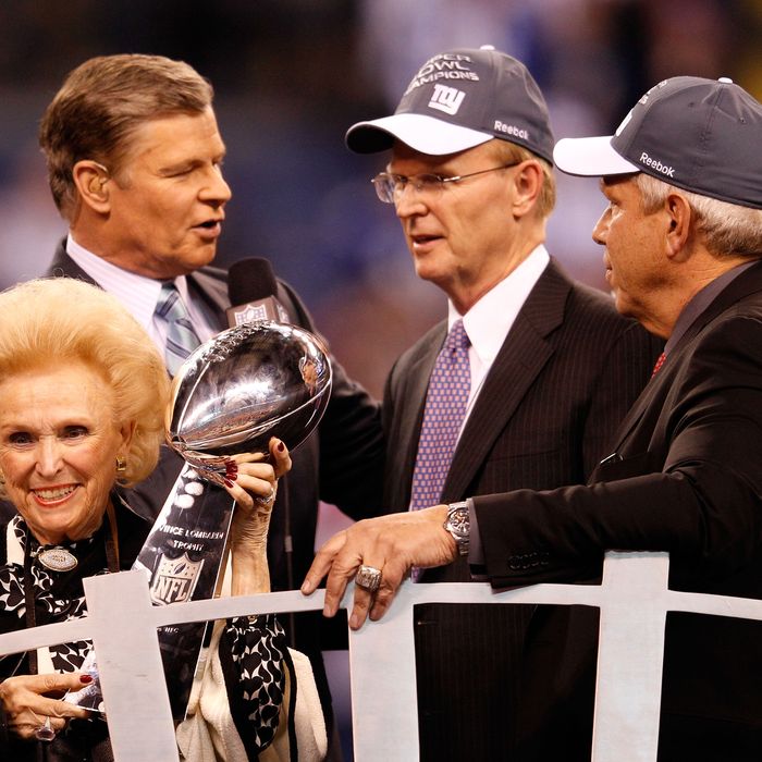 Co-Owners of the New York Giants John Mara, Steve Tisch and Ann Mara pose with the Vince Lombardi trophy