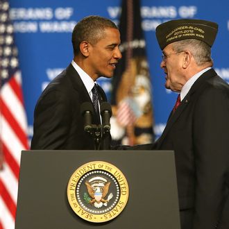 RENO, NV - JULY 23: U.S. President Barack Obama (L) greets Veterans of Foreign Wars Commander-in-Chief Richard L. DeNoyer before speaking speaks at the 113th National Convention of the Veterans of Foreign Wars of the U.S. at the Reno-Sparks Convention Center on July 23, 2012 in Reno, Nevada. President Obama addressed the 113th National Convention of the Veterans of Foreign Wars one day after visiting families of shooting victims in Aurora, Colorado. (Photo by Justin Sullivan/Getty Images)