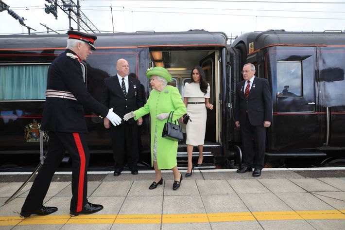 Queen Elizabeth and Meghan Markle leaving the train.