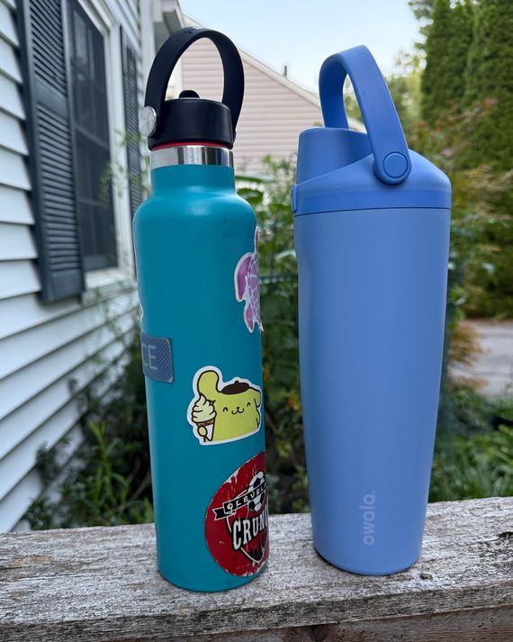 Photo of two water bottles side by side: the 24 ounce HydroFlask and 30 ounce Owala Sway.