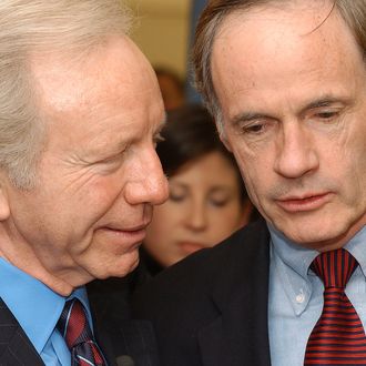 NEWARK, DELAWARE - DECEMBER 19: U.S. Sen. and Democratic Presidential candidate Joseph Lieberman (D-CT) (L) and Senator Tom Carper (D-DE) (R) speak at M Cubed Technologies on Decemeber 19, 2003 during a campaign swing thru Delaware. M Cube Technologies manufactures the material used in bullet proof vests used by the Military. (Photo by Jeff Fusco/Getty Images)