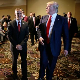 Republican presidential candidate Donald Trump walks with his campaign manager Corey Lewandowski, left, after speaking at a news conference, Tuesday, Aug. 25, 2015, in Dubuque, Iowa.