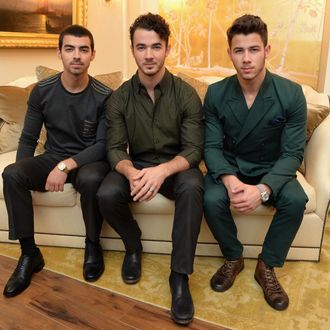 Joe Jonas, Kevin Jonas, and Nick Jonas of the Jonas Brothers attend the Mercedes-Benz Star Lounge during Mercedes-Benz Fashion Week Spring 2014 at Lincoln Center on September 5, 2013 in New York City. 