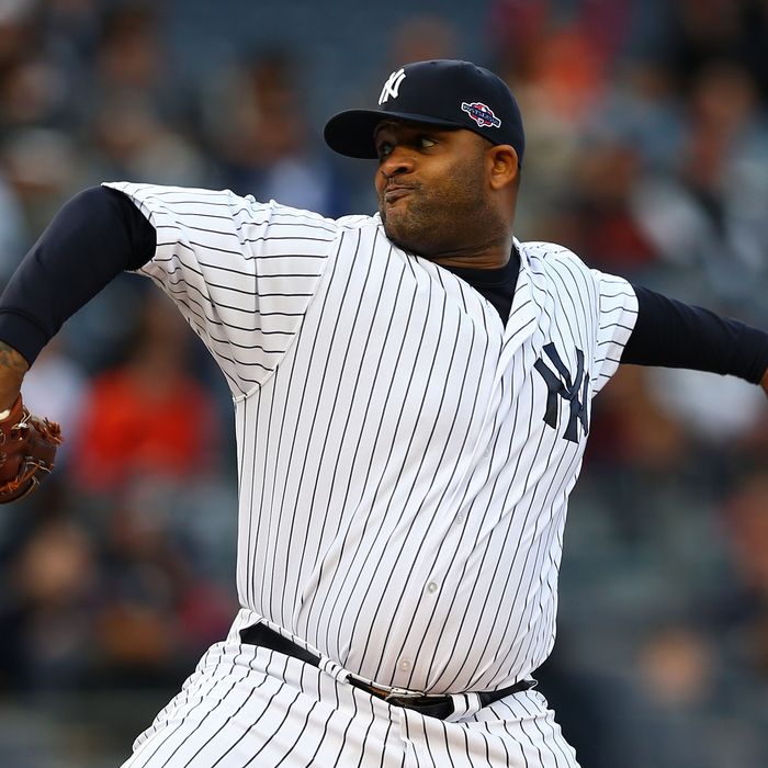 NEW YORK, NY - OCTOBER 12: CC Sabathia #52 of the New York Yankees pitches in the first inning against the Baltimore Orioles during Game Five of the American League Division Series at Yankee Stadium on October 12, 2012 in New York, New York. (Photo by Elsa/Getty Images)