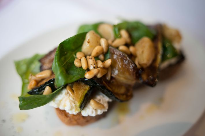 Bruschetta with zucchini, ricotta, and pine nuts.