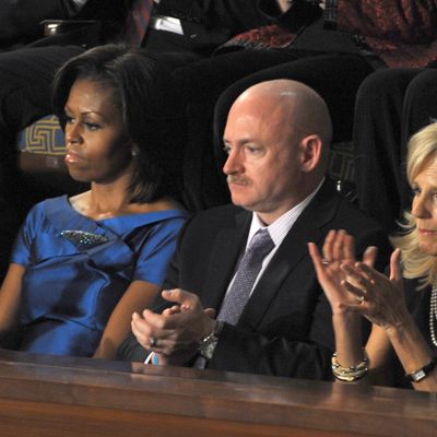 24 Jan 2012, Washington, DC, USA --- President Barack addresses Congress during his annual State of the Union Address. Captian Mark Kelly husband of Cong, Gabrielle Giffords sits in the First Lady's Box between First Lady Michelle Obama and Dr. Jill Biden.