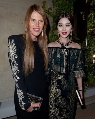 Anna Dello Russo and Fan Bing Bing attend the Salvatore Ferragamo Cruise Collection 2013 show presented at Galerie Denon at the Louvre Museum on June 12, 2012 in Paris, France.