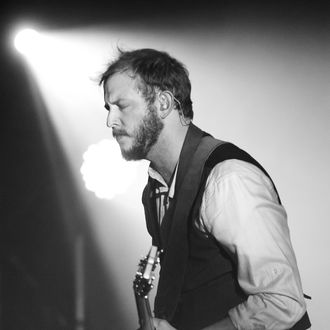 SYDNEY, AUSTRALIA - MARCH 11: (EDITORS NOTE: Image has been converted to black and white.) Justin Vernon of Bon Iver performs on stage at the Sydney Opera House on March 11, 2012 in Sydney, Australia. (Photo by Mark Metcalfe/Getty Images)