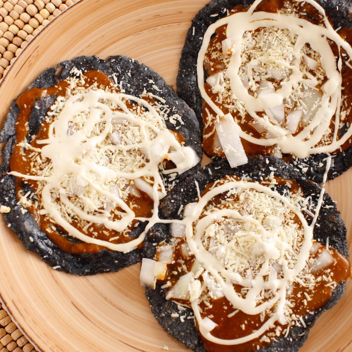 Pueblan-style chalupas, made with blue corn tortillas that are nixtamalized in house.
