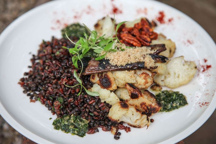 Grilled baby eggplant and farofa with red rice, lentil, dates, roasted cauliflower, and smoky pecans.
