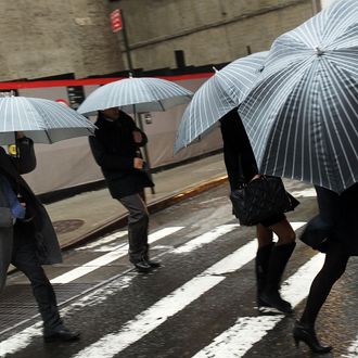 Pedestrians battle wind and rain in New York City