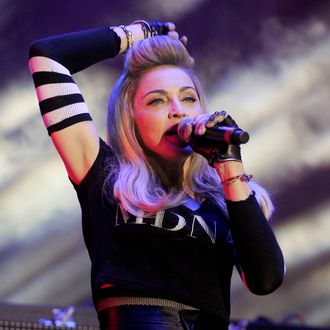 Madonna introduces Avicii as part of Day Two of Ultra Music Festival 14 at Bayfront Park on March 24, 2012 in Miami, Florida.