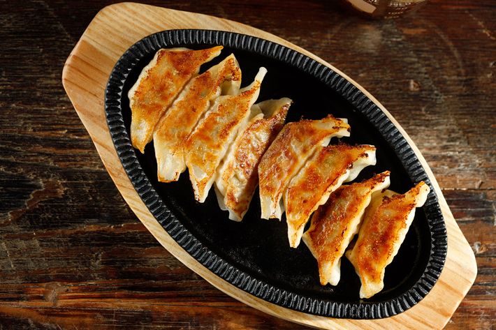 The teppan gyoza (pork, cabbage, and ginger) come out sizzling.