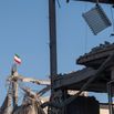 An Iranian national flag atop the ruins of a building in a residential area in Tehran, Iran, on April 9, 2026.