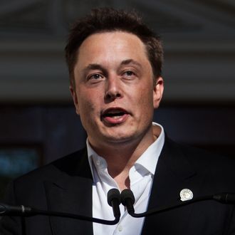 Elon Musk, CEO of Tesla Motors, speaks at a press conference at the Nevada State Capitol, September 4, 2014 in Carson City, Nevada.
