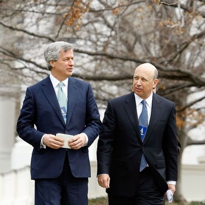 JP Morgan Chase CEO Jamie Dimon (L) and Goldman Sachs CEO Lloyd Blankfein leave the White House after they and 13 other bank heads met with President Barack Obama March 27, 2009 in Washington, DC. Obama used the meeting to tell the bankers that they must look beyond short-term interests toward obligations each person has in order to make it through the current economic troubles.