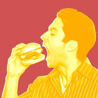 Man eating hamburger