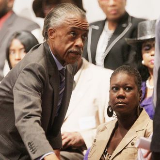 EATONVILLE, FL - MARCH 26: Rev. Al Sharpton (C) and Sybrina Fulton (LOWER R), mother of slain teenager Trayvon Martin, attend a community forum on the killing of Trayvon Martin at Macedonia Baptist Church on March 26, 2012 in Eatonville, Florida. A march and rally are planned for later this afternoon in Sanford which will hold a town hall meeting on the incident at 5:00 p.m. (Photo by Mario Tama/Getty Images)
