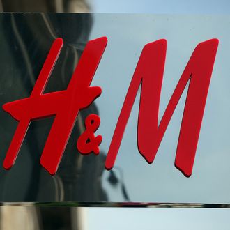 The Hennes & Mauritz AB (H&M) company logo hangs at a store in London, U.K., on Wednesday, June 23, 2010.