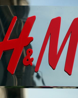 The Hennes & Mauritz AB (H&M) company logo hangs at a store in London, U.K., on Wednesday, June 23, 2010.