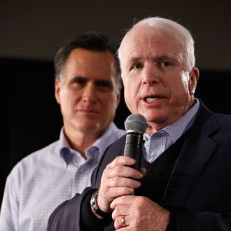  Former presidential nominee, U.S. Sen. John McCain (R-AZ) (R) announces that he is endorsing Republican presidential candidate and former Massachusetts Gov. Mitt Romney during a town hall meeting at Central High School January 4, 2012 in Manchester, New Hampshire.
