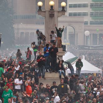 Members of a crowd numbering tens of thousands smoke marijuana and listen to live music, at the Denver 420 pro-marijuana rally at Civic Center Park in Denver on Saturday, April 20, 2013. Even before the passage in November 2012 of Colorado Amendment 64 promised the legalization of marijuana for recreational use, April 20th has for years been a celebration of marijuana counterculture, and the 2013 Denver rally draw larger crowds than previous years. (AP Photo/Brennan Linsley)