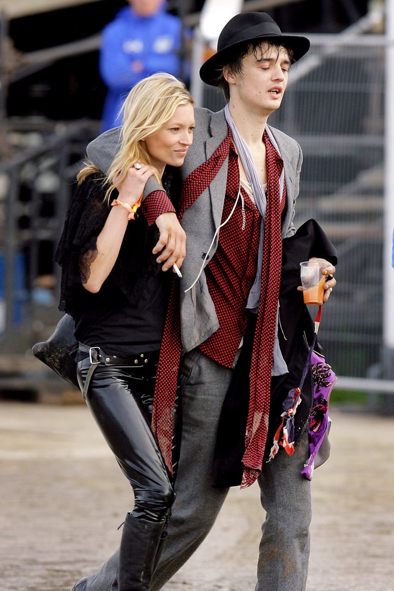 GLASTONBURY, UNITED KINGDOM - JUNE 23:  Pete Doherty and Kate Moss walk backstage the Other Stage at Worthy Farm, Pilton near Glastonbury, on June 23 2007 in Somerset, England. The festival, that was started by dairy farmer Michael Eavis in 1970, has grown into the largest music festival in Europe. This year’s festival is the biggest yet and will have headline acts including The Who, The Artic Monkeys and The Killers.  (Photo by Matt Cardy/Getty Images)