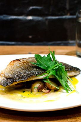 Dourade with pickled banana, saffron, potatoes, and pearl onions.