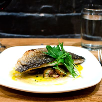 Dourade with pickled banana, saffron, potatoes, and pearl onions.