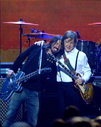 Musicians Dave Grohl (L) and Sir Paul McCartney perform onstage at the 2012 MusiCares Person of the Year Tribute to Paul McCartney held at the Los Angeles Convention Center on February 10, 2012 in Los Angeles, California.