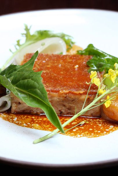 confit with dried apricots, onions, wild greens