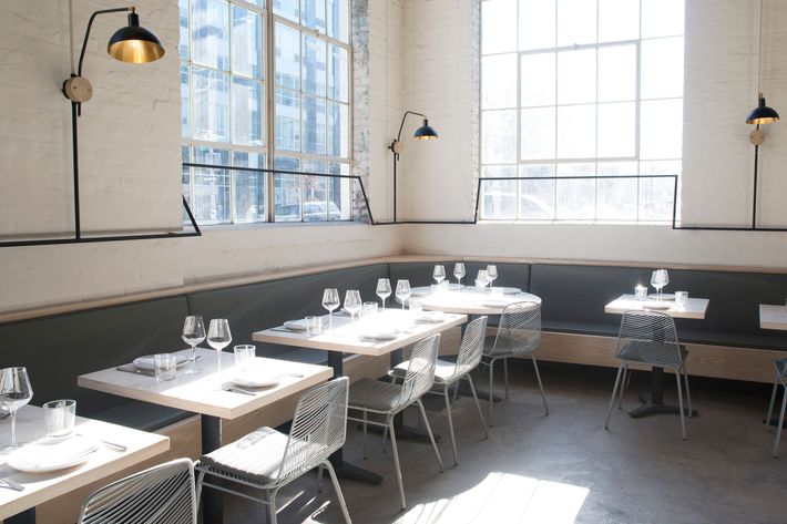 The restaurant occupies a former auto-body shop. Casement windows let in tons of light.