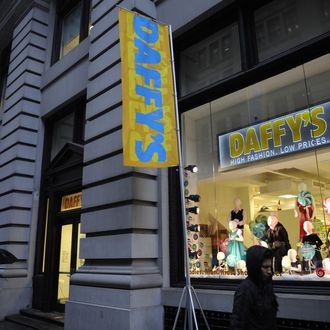 Shoppers walk past Daffy's, a fashion brand name discount chain store, in New York, December 11, 2008.