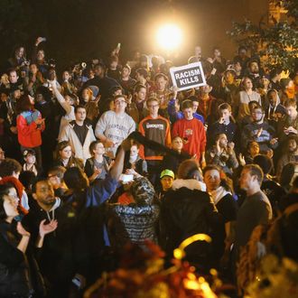 Demonstrators listen to speakers during a rally on the campus of Saint Louis University on October 13, 2014 in St Louis, Missouri. 