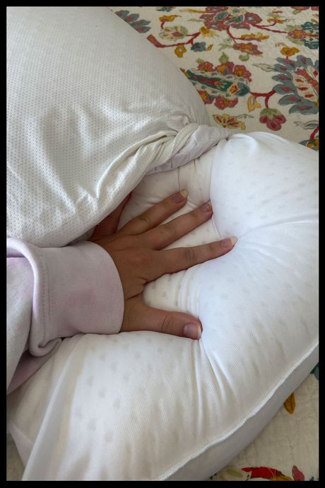 The Purple Harmony pillow unzipped to show the latex core.