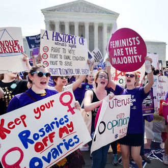 Abortion rights activists cheer after the US Supreme Court struck down a Texas law placing restrictions on abortion clinics, outside of the Supreme Court on June 27, 2016 in Washington, DC.