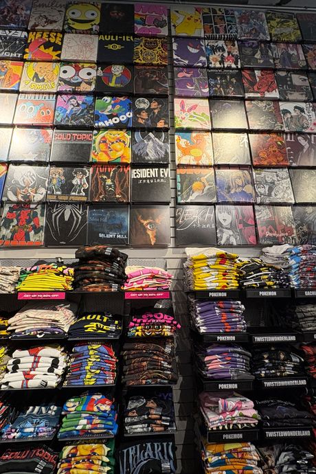A large display of assorted graphic tees.