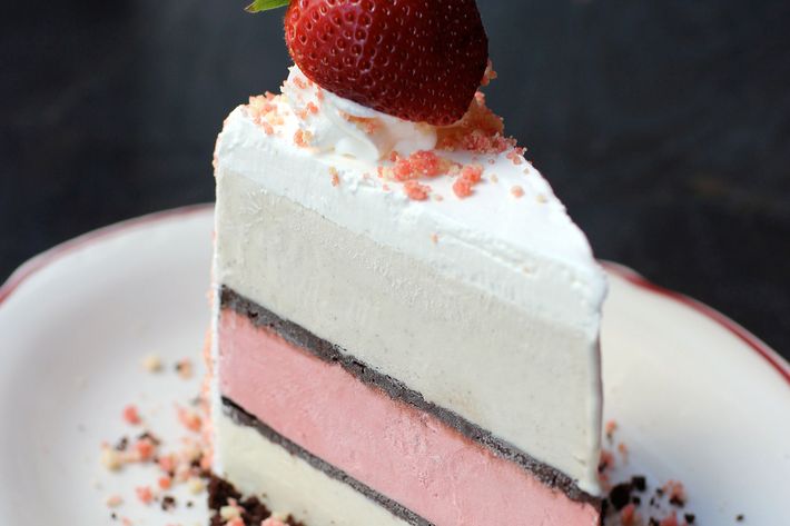 The layers within: strawberry, yellow cake, and vanilla bean.