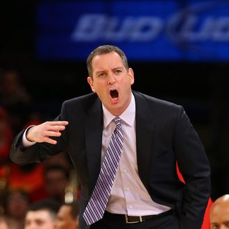 Head coach Mike Rice of the Rutgers Scarlet Knights shouts instructions to his team against Notre Dame Fighting Irish during the second round of the Big East Tournament at Madison Square Garden on March 13, 2013 in New York City.