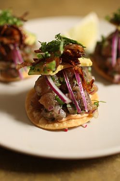 House-made tostadas, ceviche style tuna, avocado, chipotle mayo, crispy onions, lime