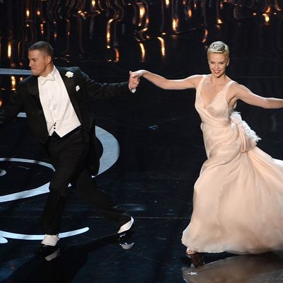 HOLLYWOOD, CA - FEBRUARY 24: Actor Channing Tatum and actress Charlize Theron dance onstage during the Oscars held at the Dolby Theatre on February 24, 2013 in Hollywood, California. (Photo by Kevin Winter/Getty Images)