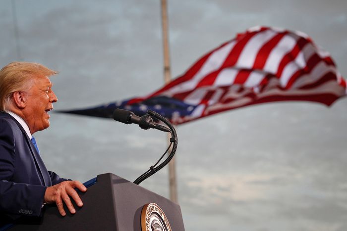 A flag appears to flow out of President Donald Trump's mouth as he speaks in Jacksonville, Florida on September 24, 2020.